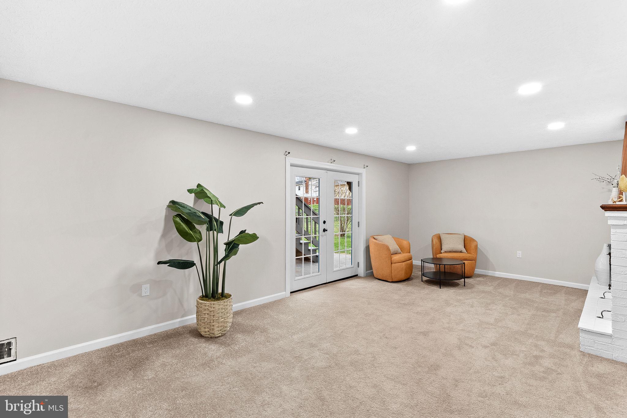 647 Battle Avenue Winchester, VA 22601 - Photo 28 of 44 a view of an empty room with window and potted plant