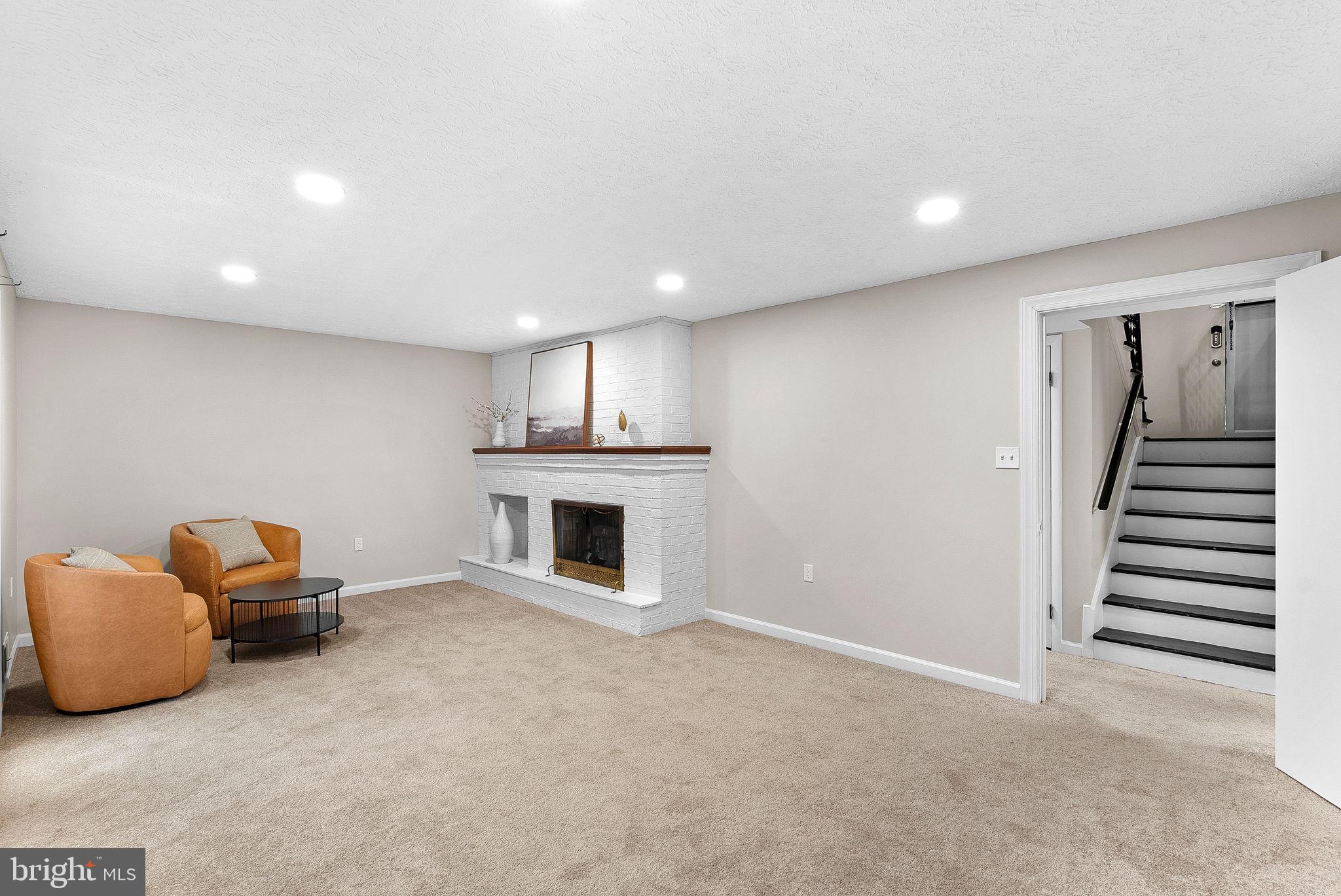 647 Battle Avenue Winchester, VA 22601 - Photo 29 of 44 a view of livingroom and fireplace with furniture