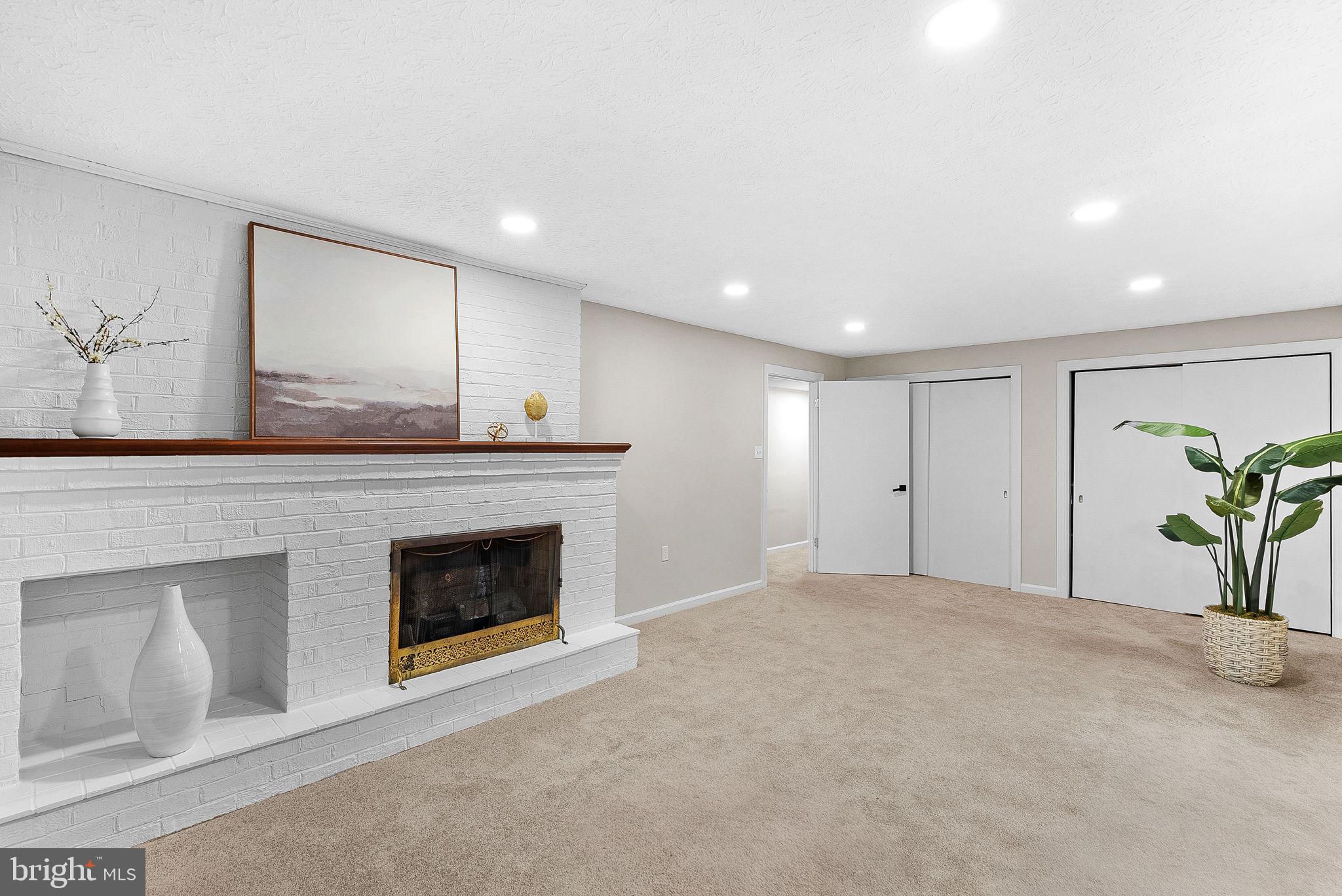 647 Battle Avenue Winchester, VA 22601 - Photo 30 of 44 a view of an empty room with a fireplace