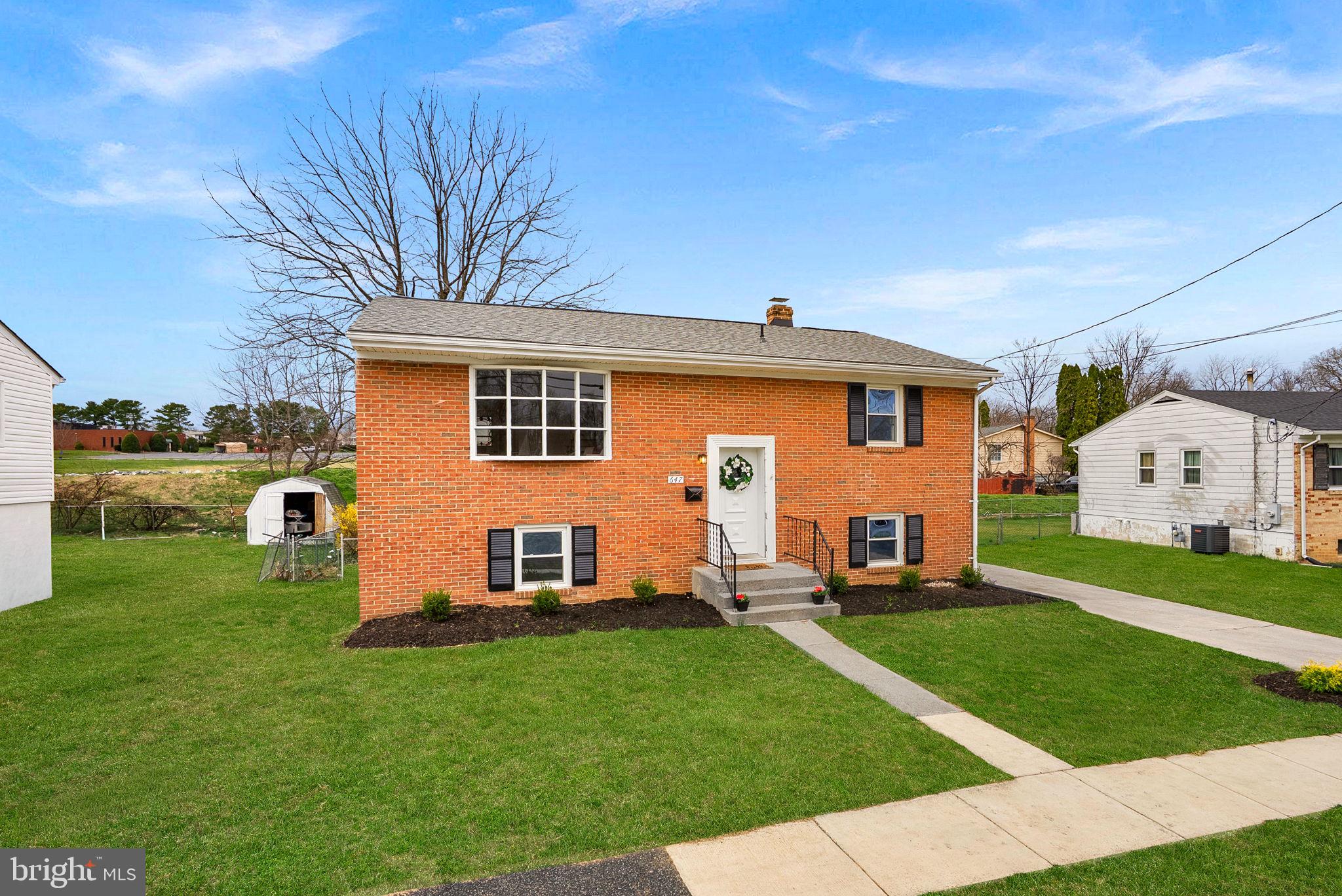 647 Battle Avenue Winchester, VA 22601 - Photo 3 of 44 a front view of a house with a garden
