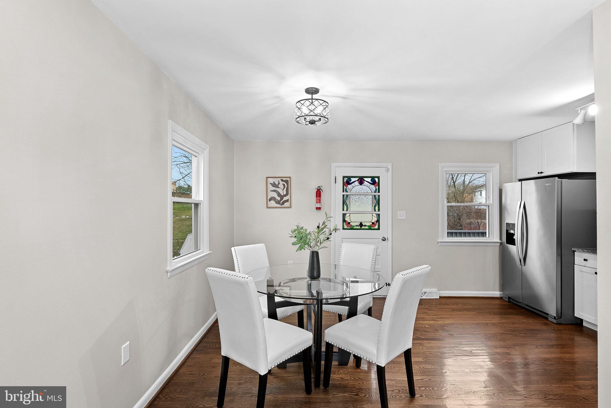 647 Battle Avenue Winchester, VA 22601 - Photo 10 of 44 a view of a dining room with furniture window and wooden floor