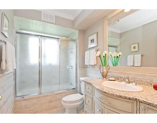 53 Park Lane, Unit 53 Park Ridge, IL 60068 - Photo 13 of 16 a bathroom with a granite countertop sink toilet and shower