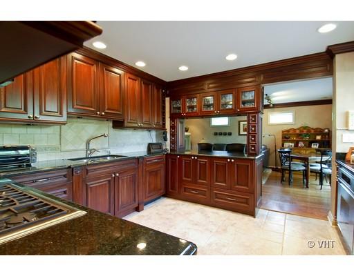 53 Park Lane, Unit 53 Park Ridge, IL 60068 - Photo 3 of 16 a kitchen with stainless steel appliances granite countertop a stove a sink and a microwave