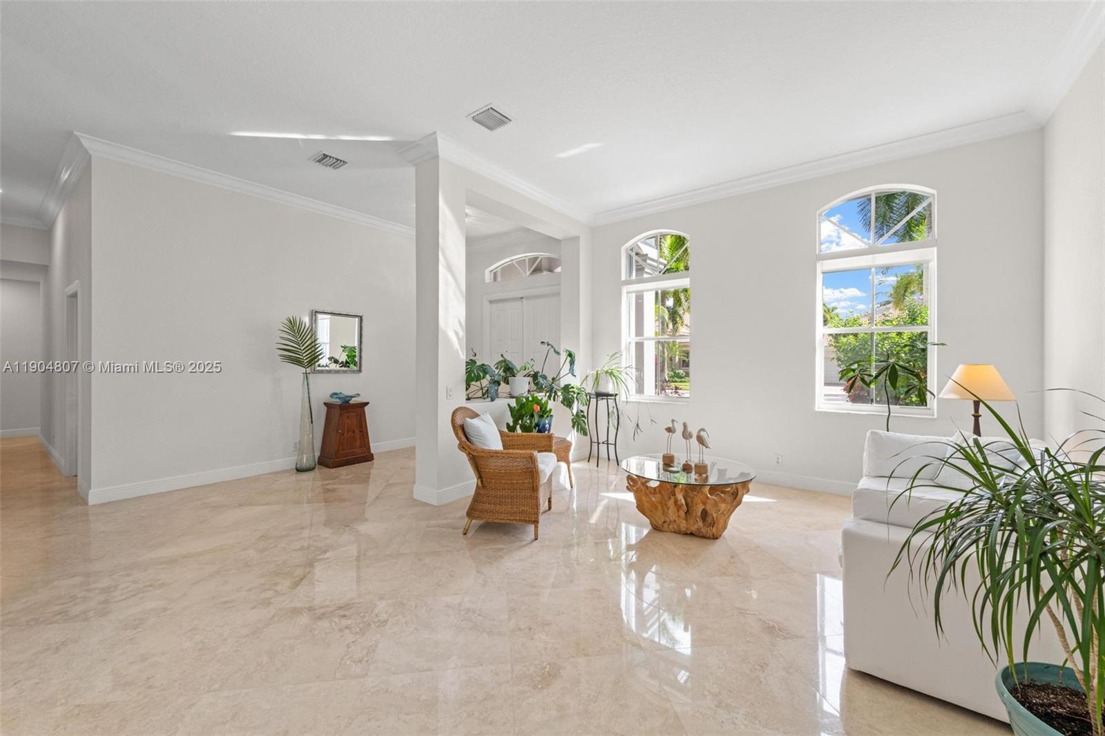 1967 Timberline Road Weston, FL 33327 - Photo 12 of 56 a living room with furniture and potted plants