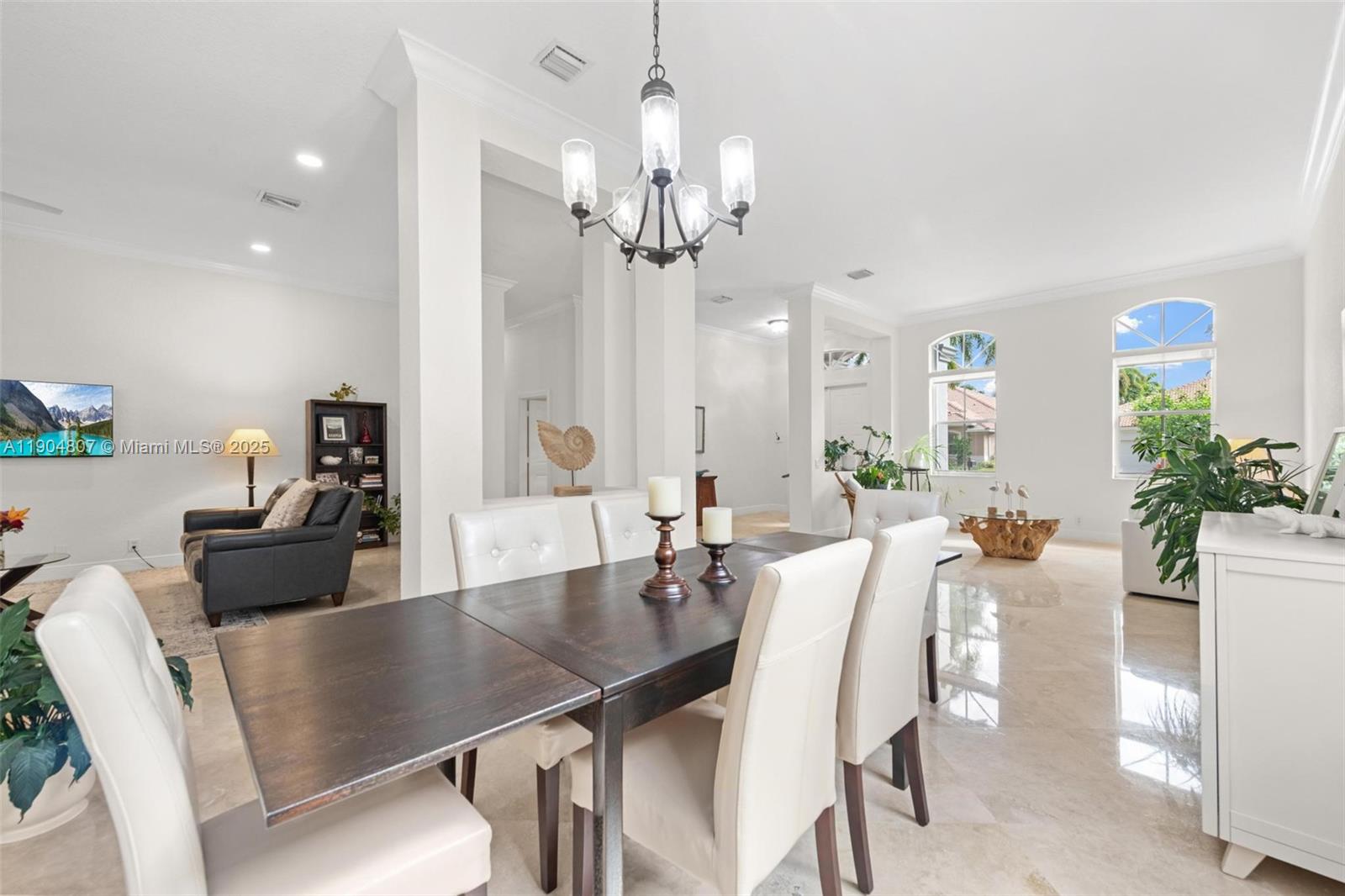 1967 Timberline Road Weston, FL 33327 - Photo 15 of 56 a view of a dining room with furniture and wooden floor