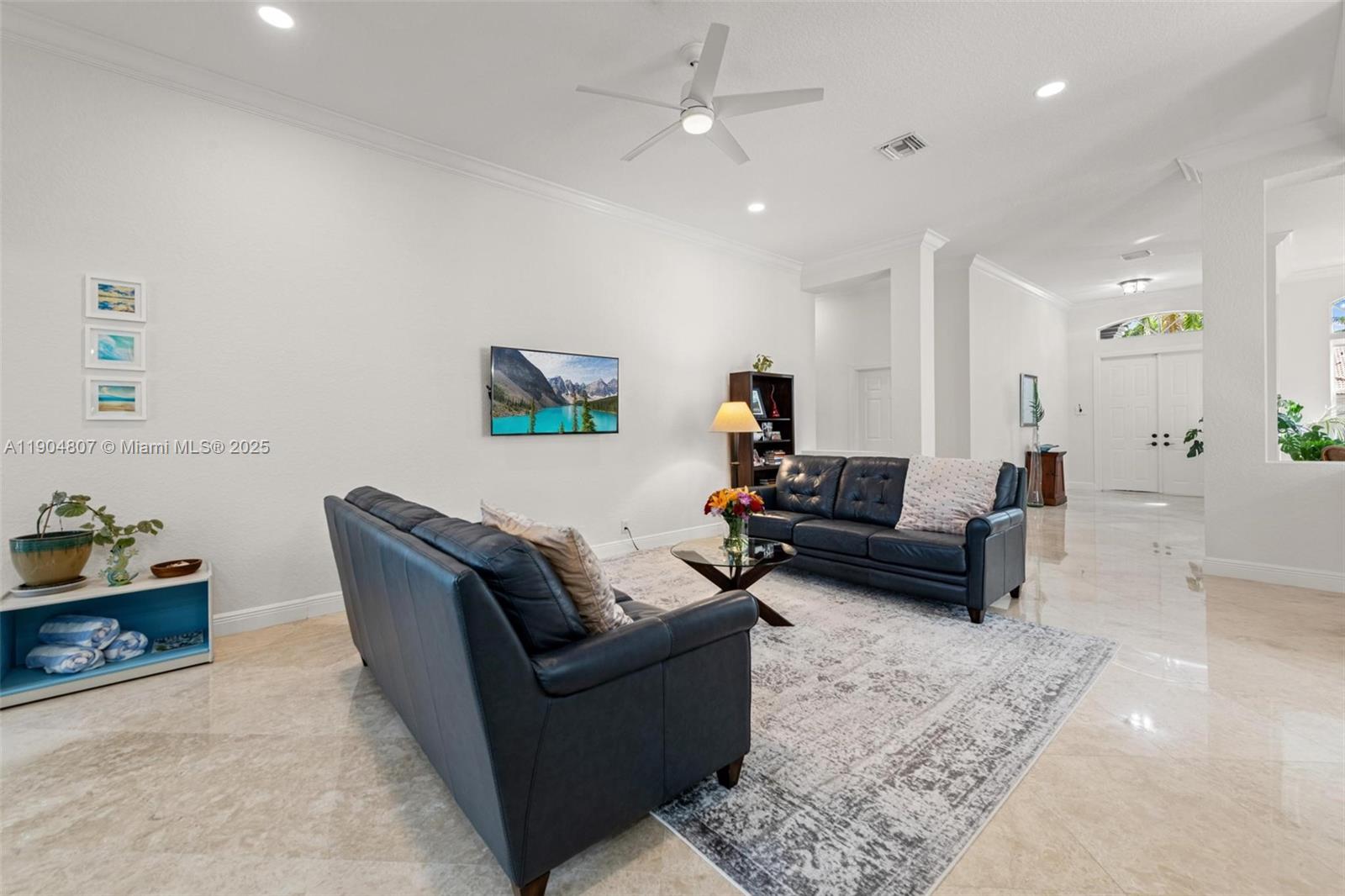 1967 Timberline Road Weston, FL 33327 - Photo 19 of 56 a living room with furniture and a couch