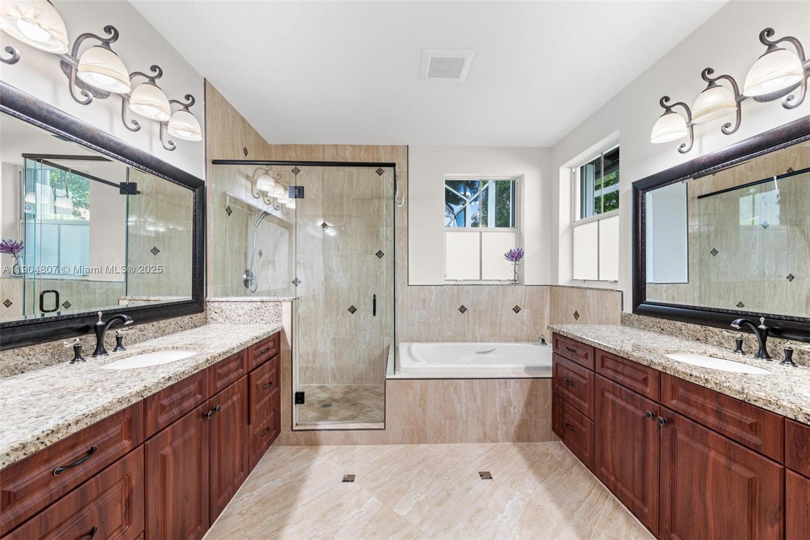 1967 Timberline Road Weston, FL 33327 - Photo 31 of 56 a spacious bathroom with a double vanity sink mirror double and bathtub