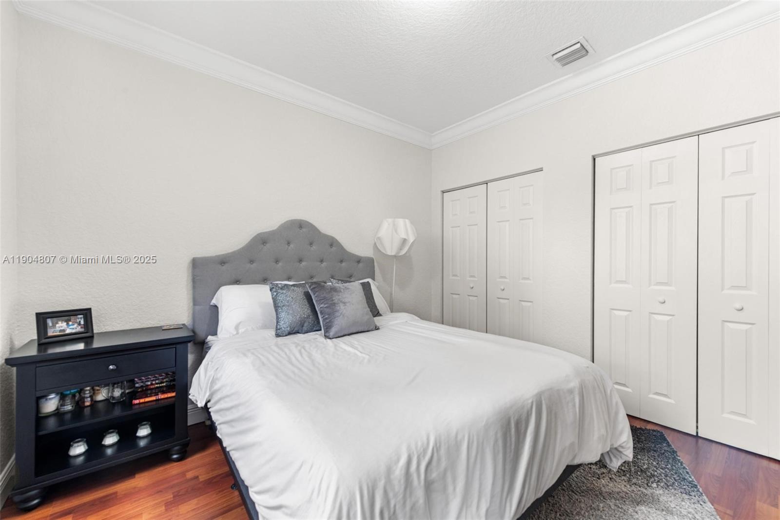 1967 Timberline Road Weston, FL 33327 - Photo 35 of 56 a bedroom with a bed and a night stand