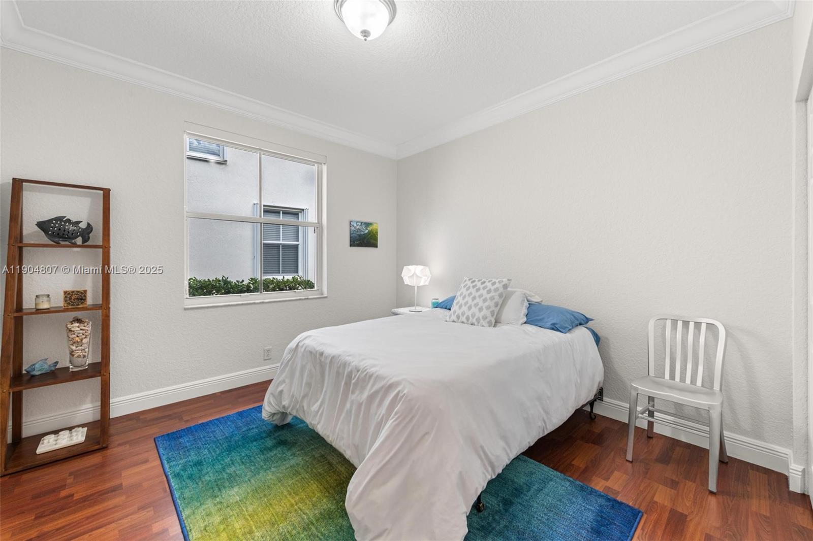 1967 Timberline Road Weston, FL 33327 - Photo 36 of 56 a bedroom with a bed and a window