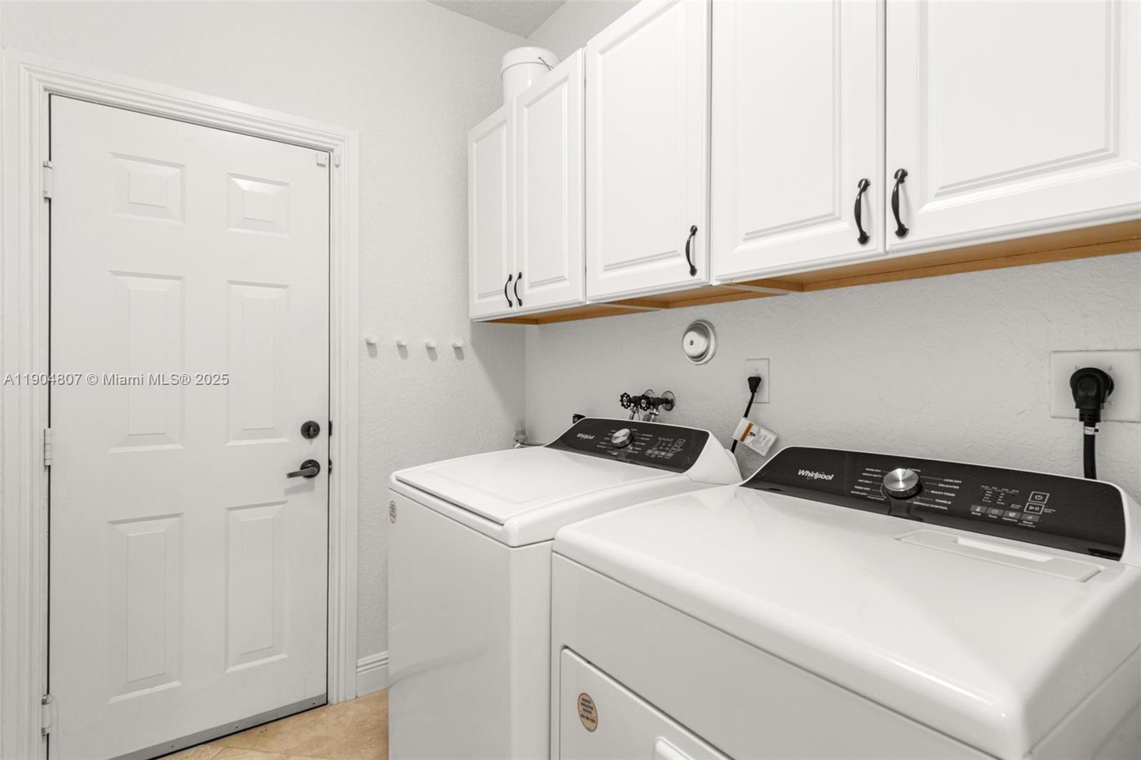 1967 Timberline Road Weston, FL 33327 - Photo 37 of 56 a utility room with dryer and washer