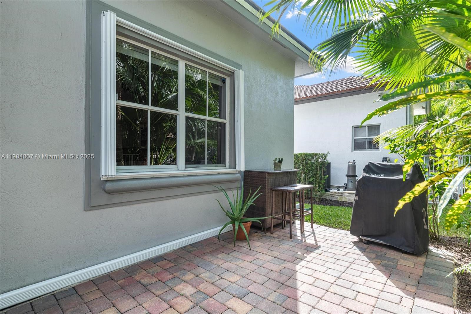 1967 Timberline Road Weston, FL 33327 - Photo 44 of 56 a view of a house with backyard and sitting area