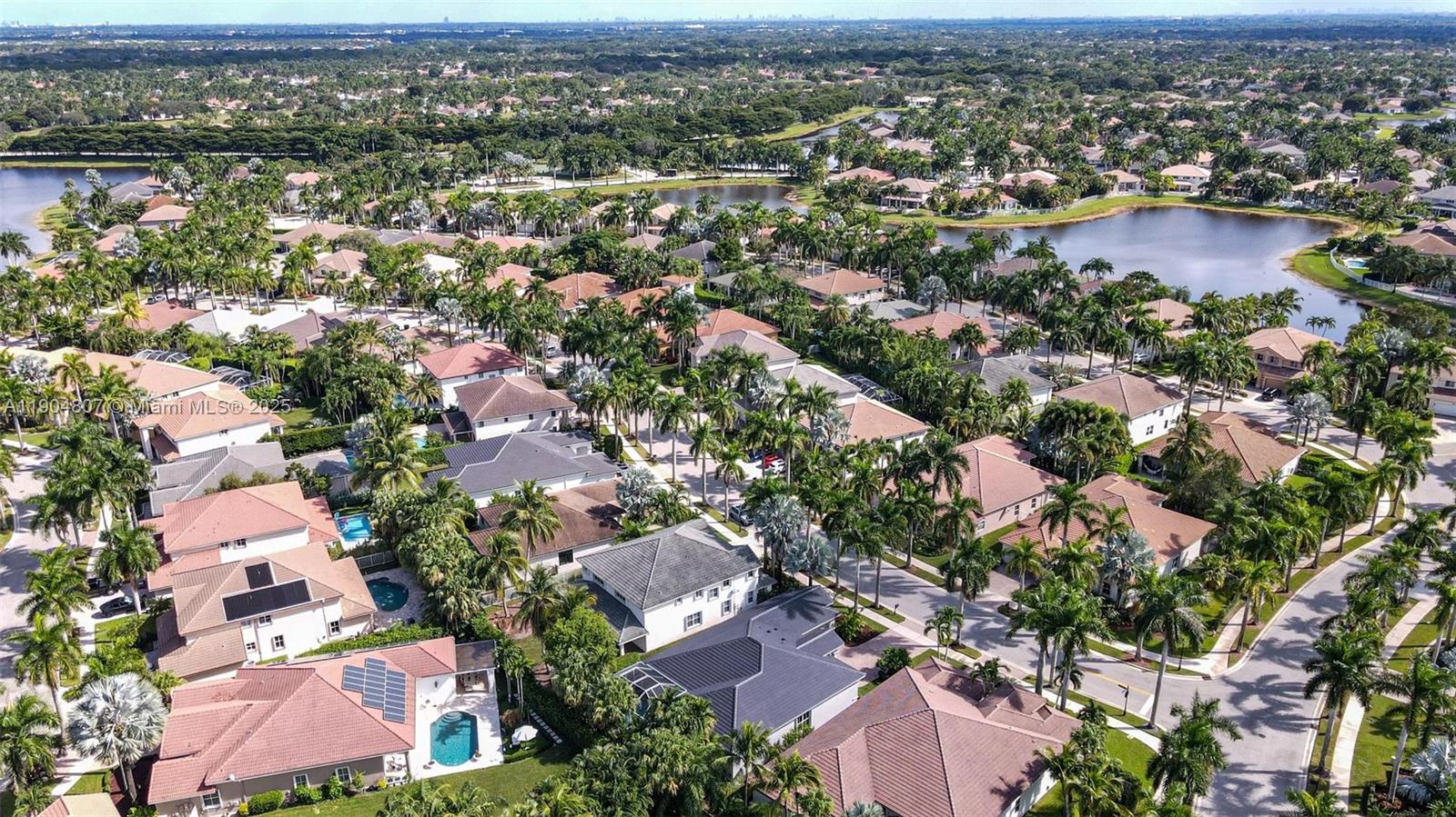 1967 Timberline Road Weston, FL 33327 - Photo 47 of 56 an aerial view of a city with lots of residential buildings