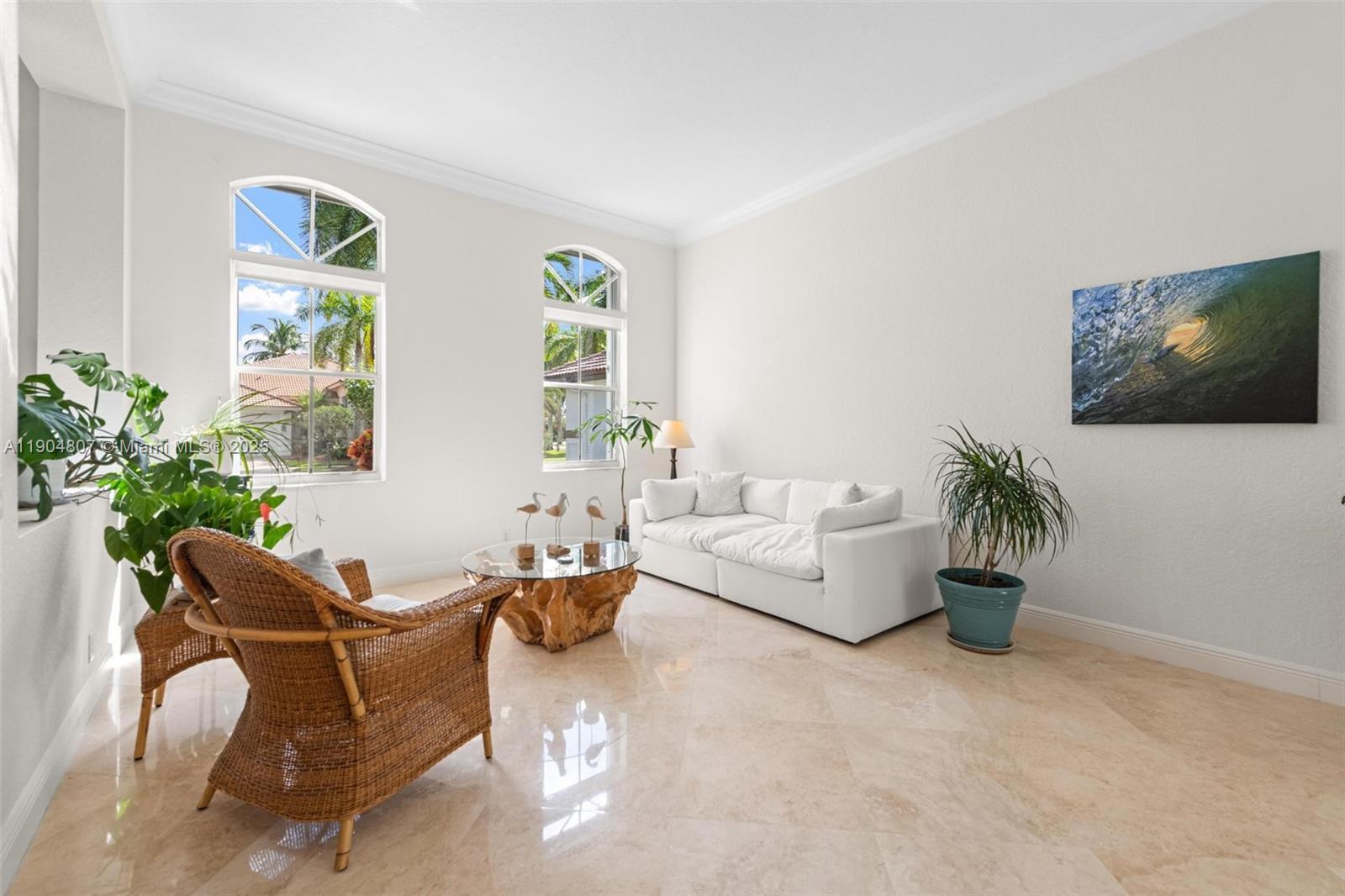 1967 Timberline Road Weston, FL 33327 - Photo 10 of 56 a living room with furniture and a potted plant