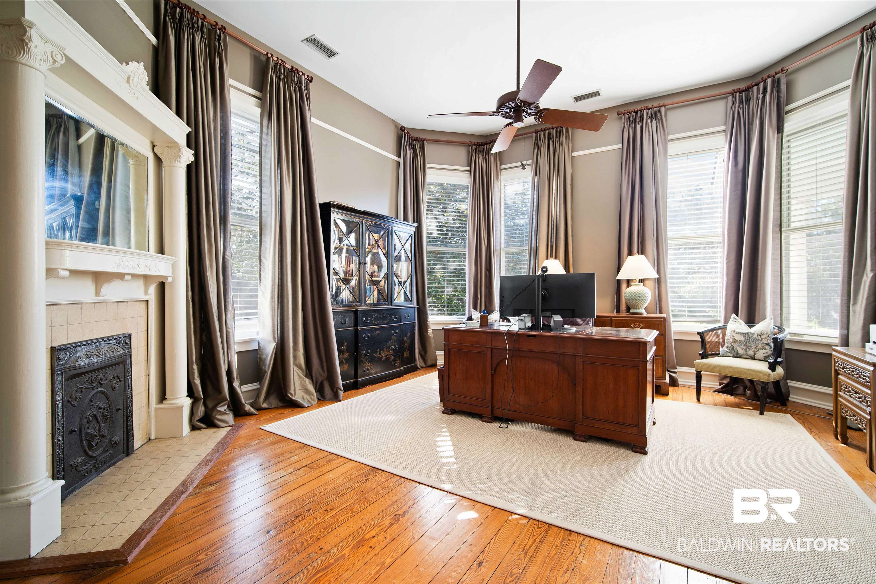 1314 Dauphin Street Mobile, AL 36604 - Photo 33 of 61 Office space attached to primary suite featuring hardwood flooring, a wealth of natural light, and fireplace