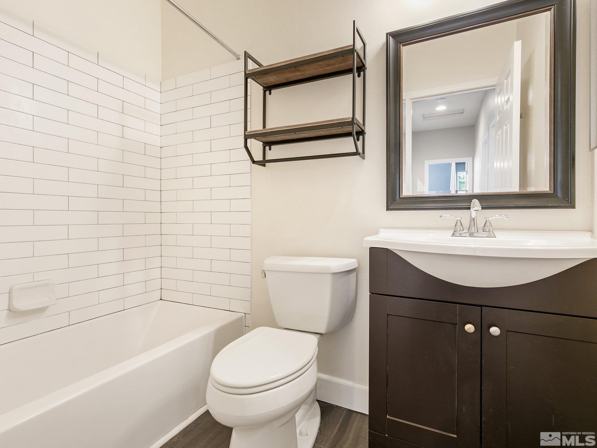 2348 Clementine Lane Reno, NV 89521 - Photo 27 of 38 a bathroom with a sink toilet and shower