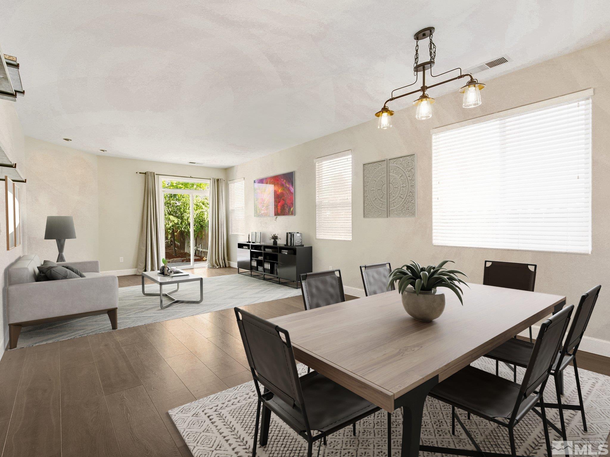 2348 Clementine Lane Reno, NV 89521 - Photo 3 of 38 a view of a dining room with furniture and wooden floor