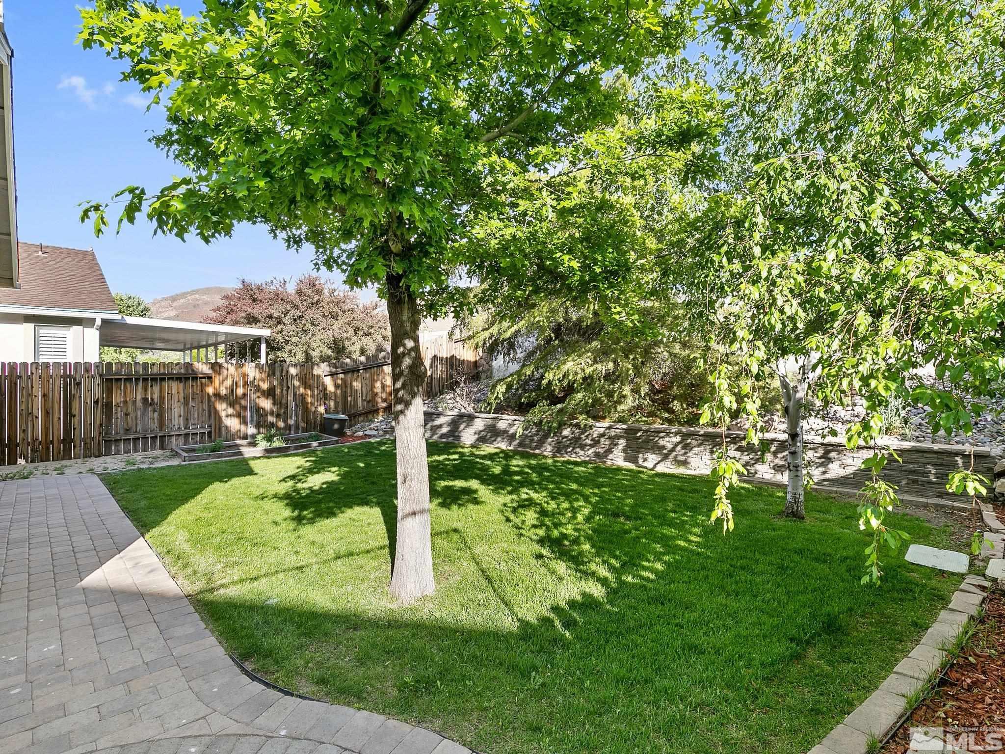 2348 Clementine Lane Reno, NV 89521 - Photo 32 of 38 a view of a garden with a tree