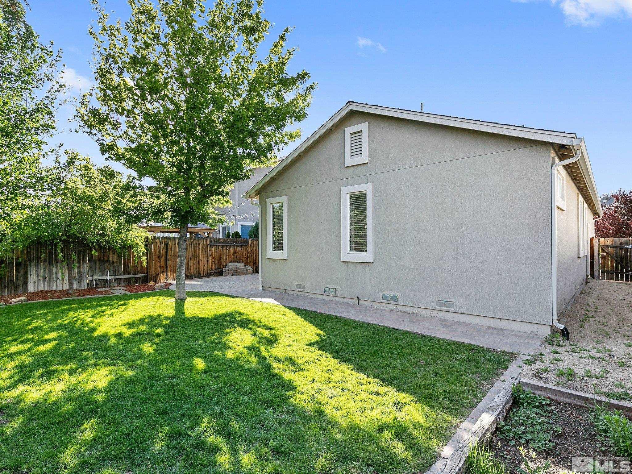 2348 Clementine Lane Reno, NV 89521 - Photo 34 of 38 a backyard of a house with table and chairs