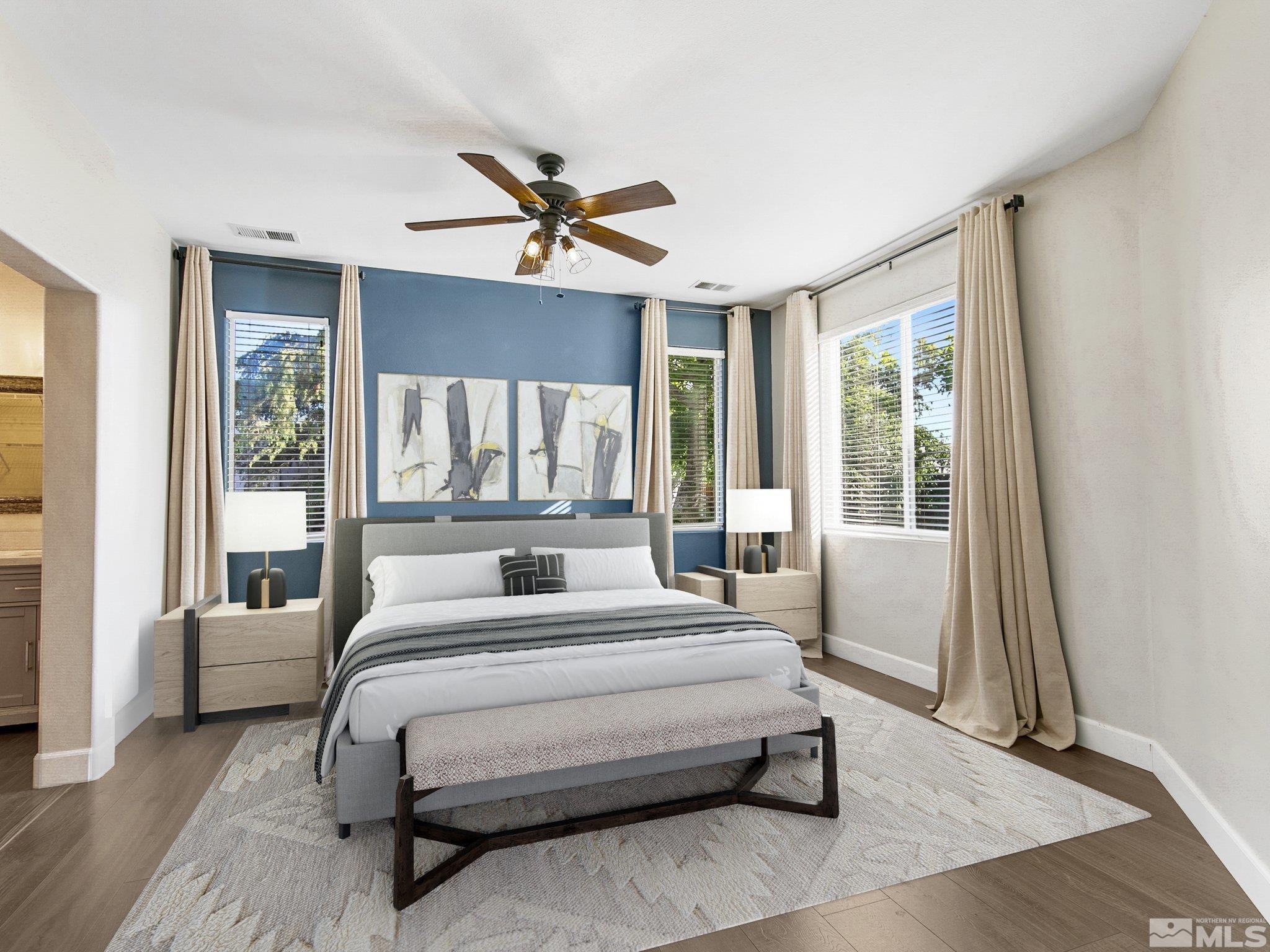 2348 Clementine Lane Reno, NV 89521 - Photo 4 of 38 a bedroom with a large bed and a large window