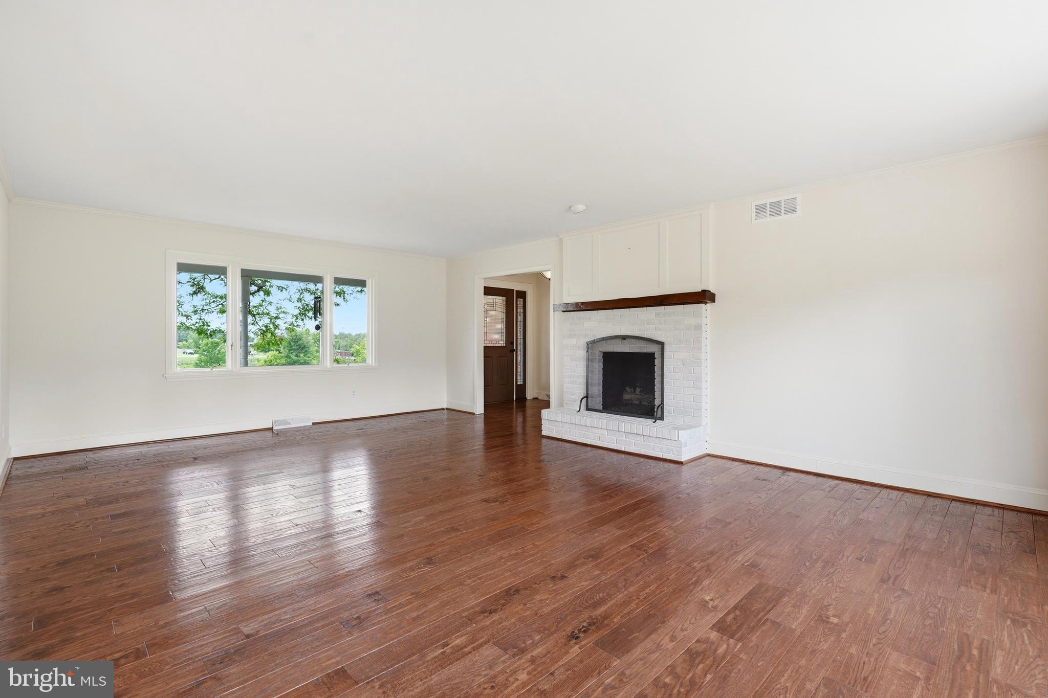 645 Mininger Road Souderton, PA 18964 - Photo 22 of 82 an empty room with wooden floor and windows