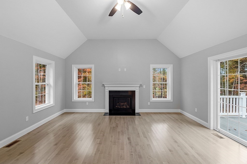 124 French Road, Unit LOT 1 Templeton, MA 01468 - Photo 21 of 42 an empty room with windows fireplace and wooden floor