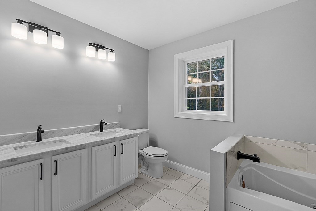 124 French Road, Unit LOT 1 Templeton, MA 01468 - Photo 30 of 42 a bathroom with a toilet sink and mirror