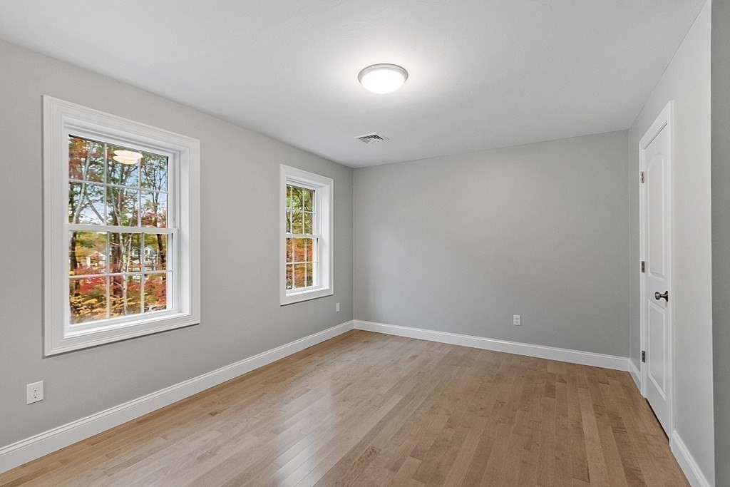 124 French Road, Unit LOT 1 Templeton, MA 01468 - Photo 38 of 42 a view of an empty room with wooden floor and a window