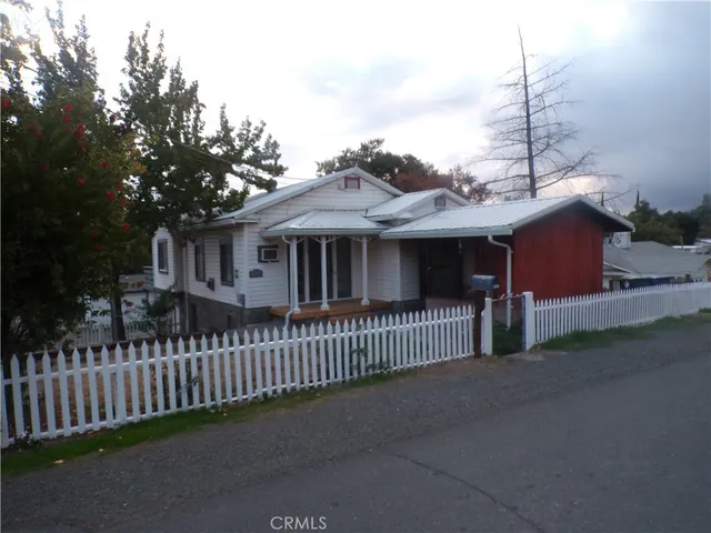a view of a house with a fence