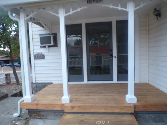 a front view of a house with a glass door