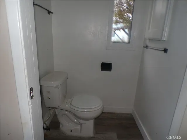 a white toilet sitting next to a sink