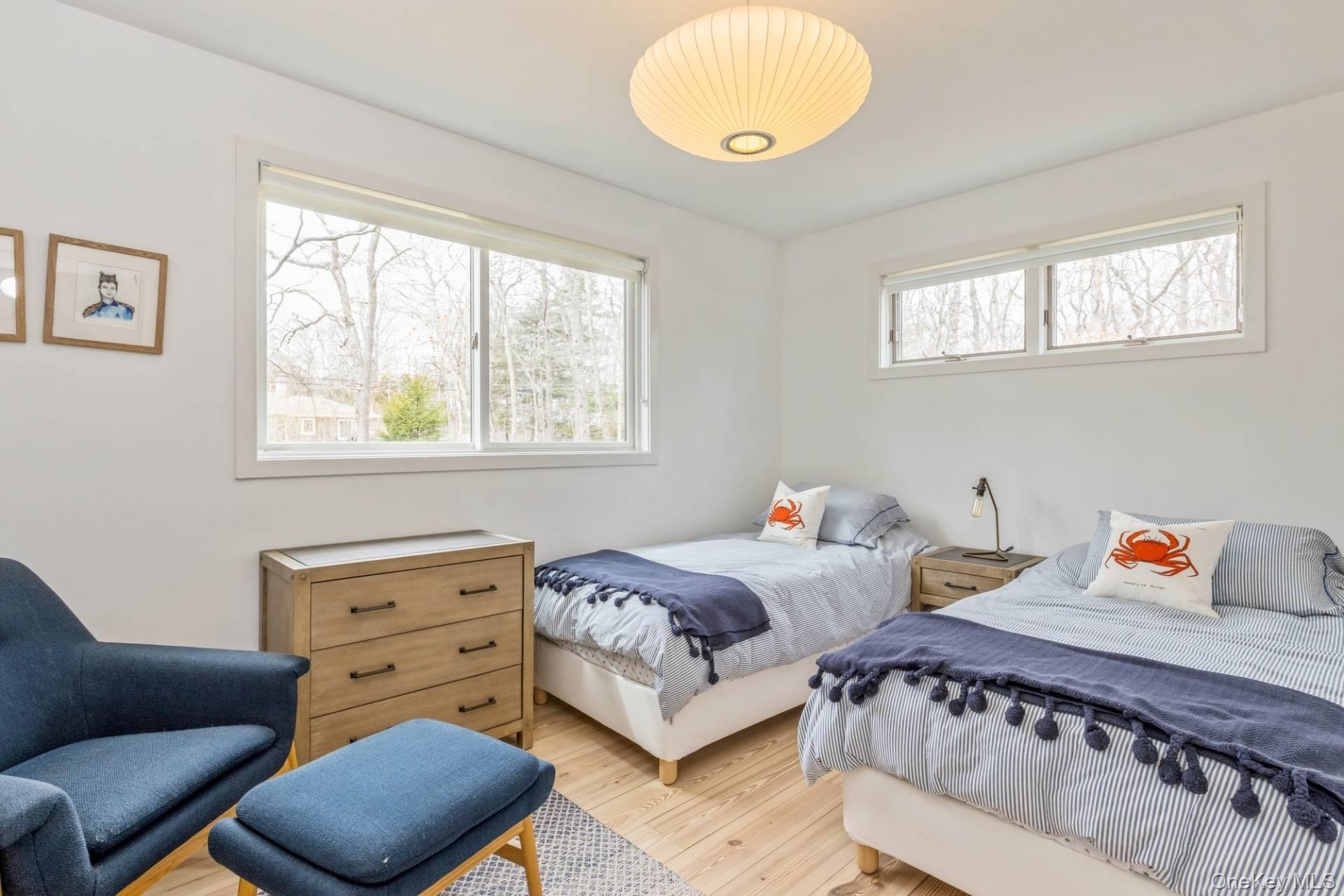 85 Camberly Road East Hampton, NY 11937 - Photo 14 of 17 a bedroom with furniture and a window