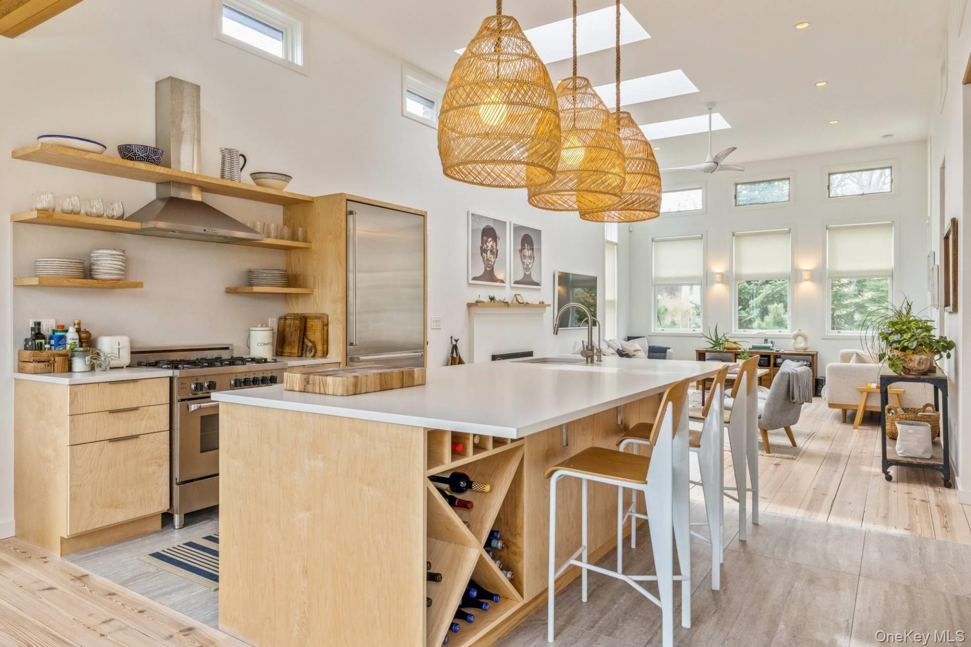85 Camberly Road East Hampton, NY 11937 - Photo 7 of 17 a kitchen with a table chairs and a view of kitchen