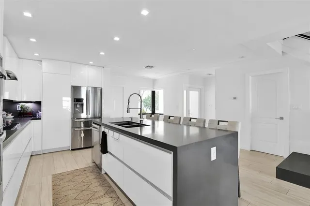 a kitchen with a sink and cabinets
