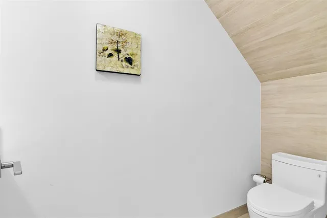 a view of a dining room with furniture a chandelier and wooden floor