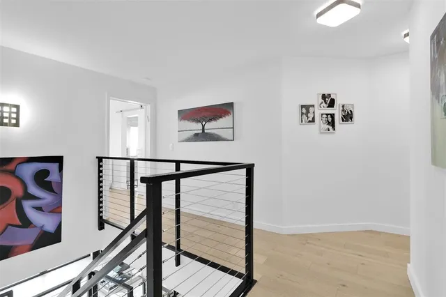 a bedroom with a bed and a night stand