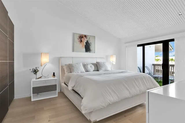 a view of a chair and tables in the balcony