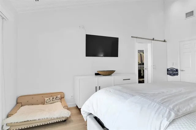 a bathroom with a double vanity sink a mirror and shower