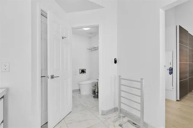 a bathroom with a shower and a toilet