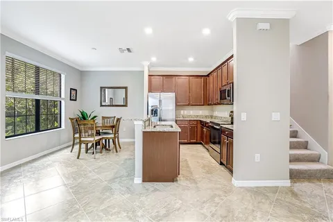 a kitchen with a stove and a microwave