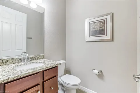 a kitchen with a table and chairs in it