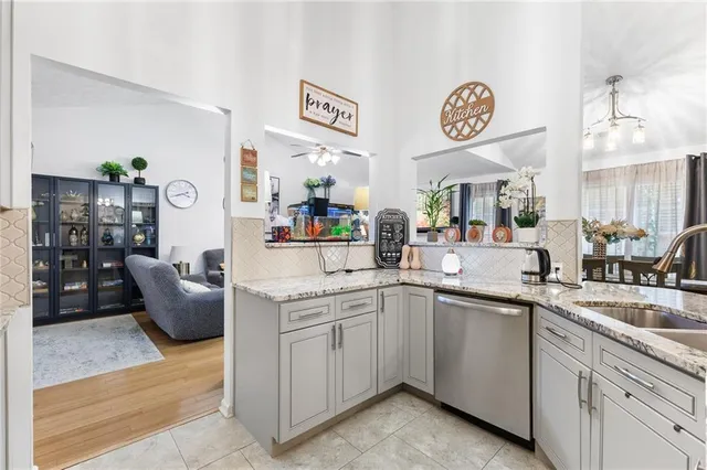 a kitchen with a sink and cabinets