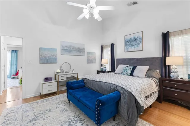 a bedroom with a bed and a couch