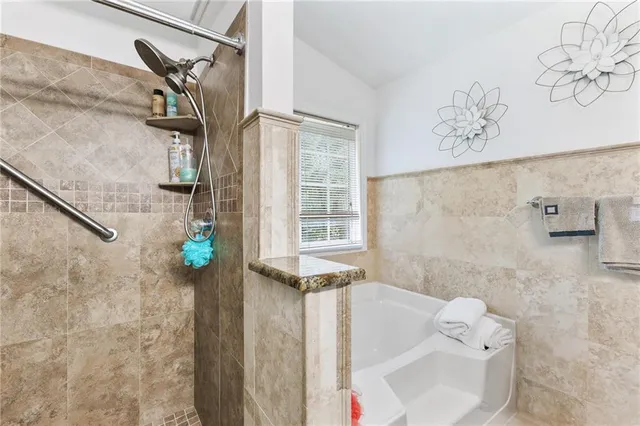 a bathroom with a sink and a shower