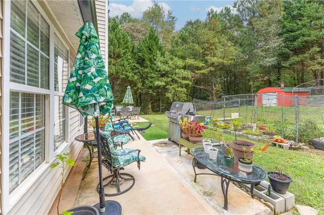 a view of a chair and tables in the patio