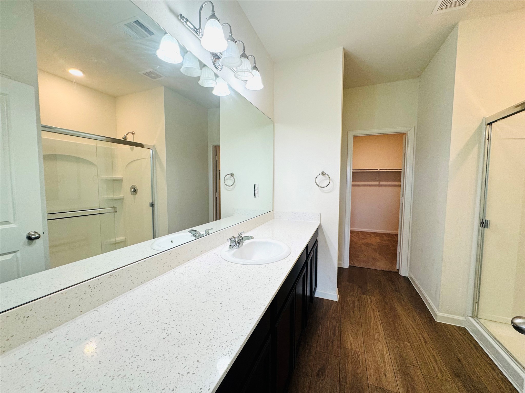 1013 Pitch Pine Brookshire, TX 77423 - Photo 19 of 30 a bathroom with a sink a large mirror and shower