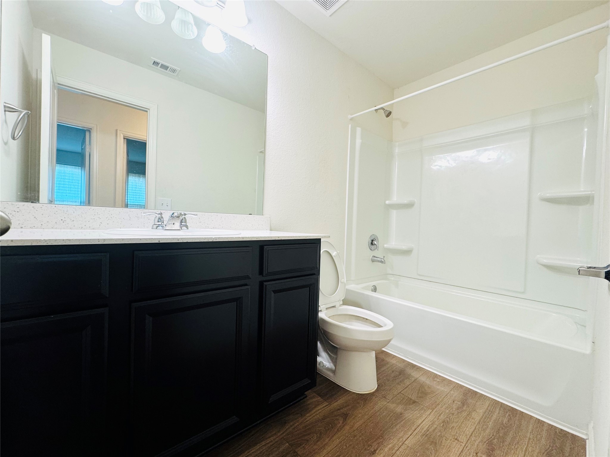 1013 Pitch Pine Brookshire, TX 77423 - Photo 24 of 30 a bathroom with a sink a toilet a mirror a bathtub and shower