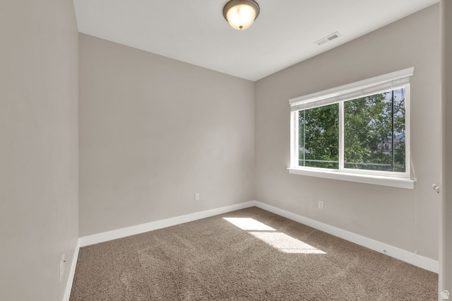 1823 North Crest Road Saratoga Springs, UT 84045 - Photo 14 of 18 Spare room with baseboards and light colored carpet