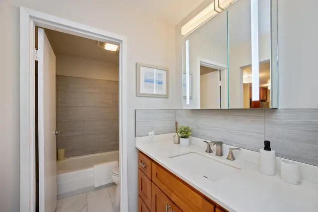 a bathroom with a sink and a shower