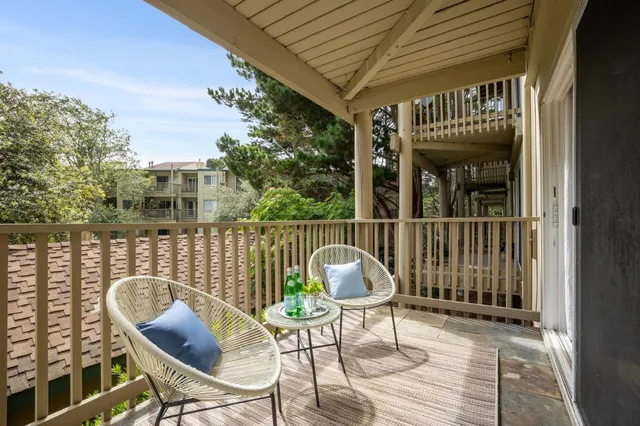 a view of balcony with furniture