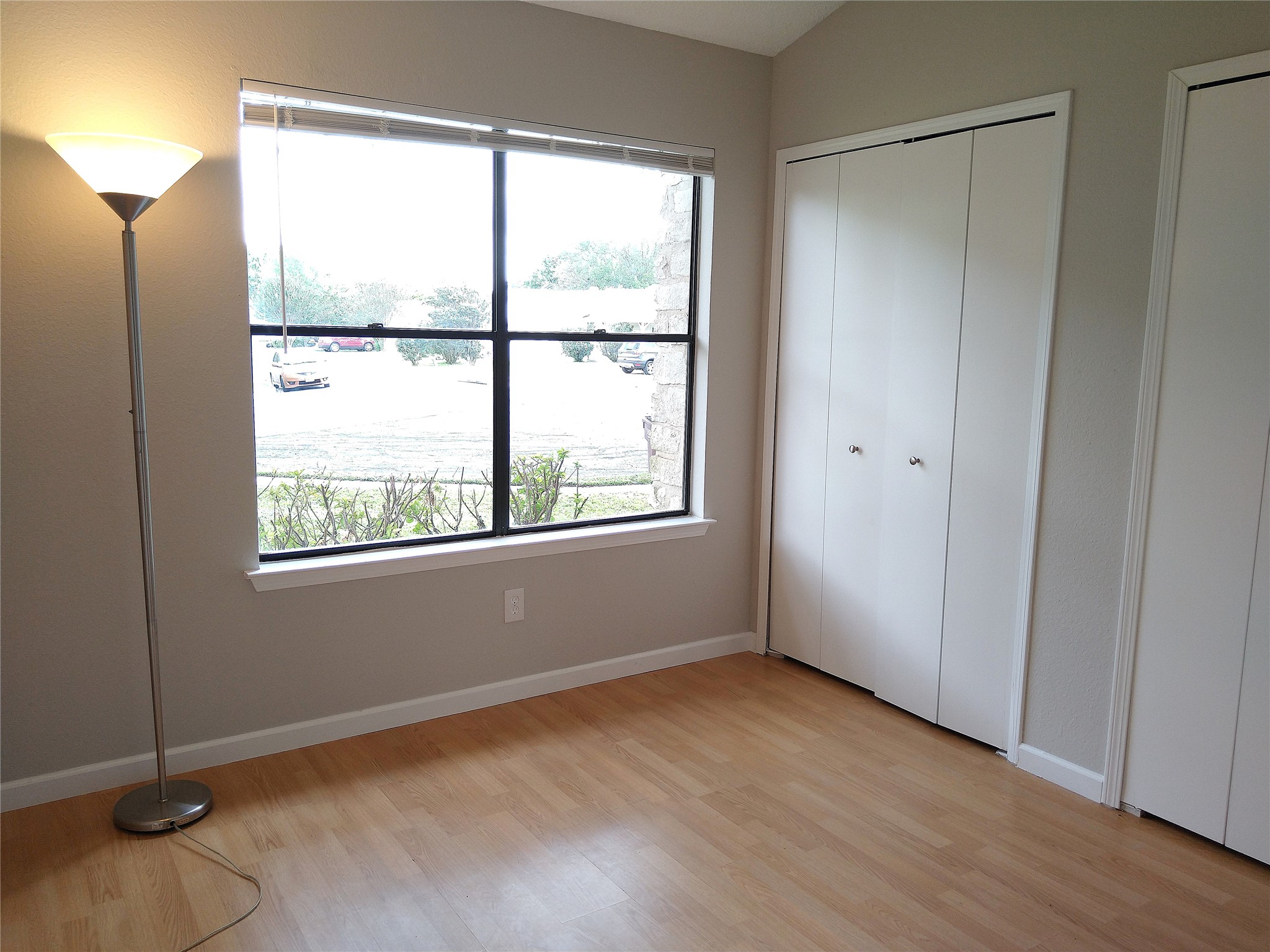 1813 Laurel Path Round Rock, TX 78664 - Photo 17 of 35 Well-lit room features wood flooring and a large picture window overlooking the outdoors.